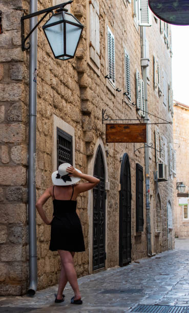istock Elegantly dressed woman with hat 1641953576