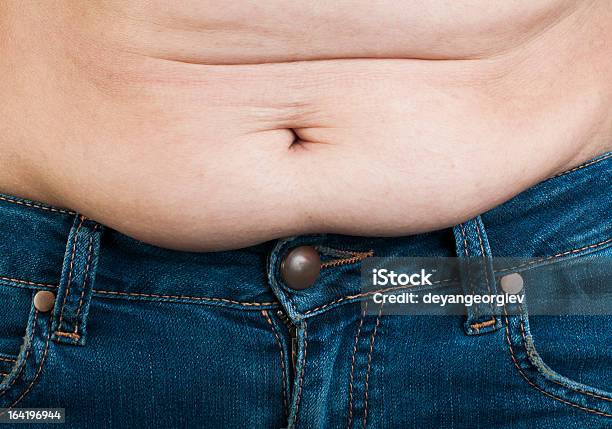 Woman Pinching Fat From Her Abdomen Stock Photo - Download Image Now - Abdomen, Adult, Anatomy