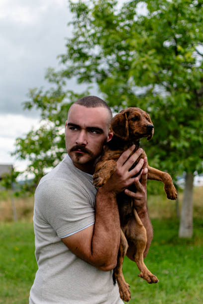 istock An image capturing joyful moments and a strong bond between a young man and his mixed breed dog 1641991918