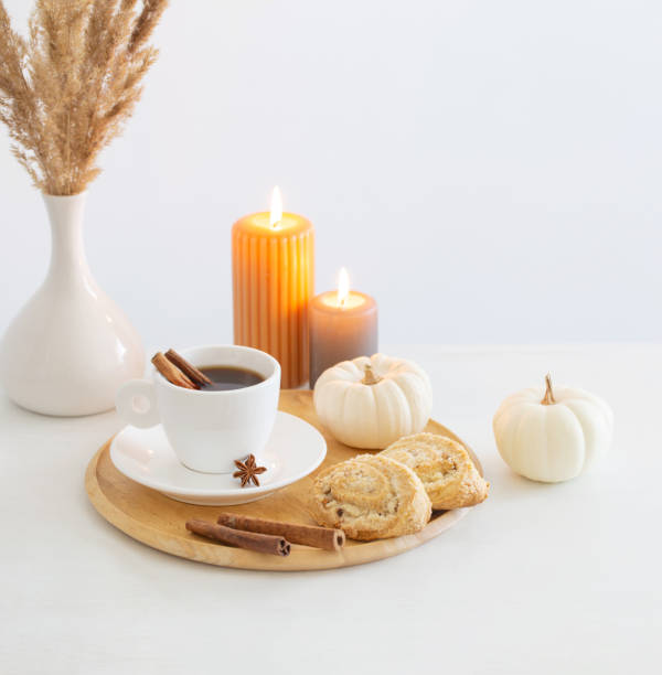 istock white cup of coffee with cozy decor on white table 1642002365
