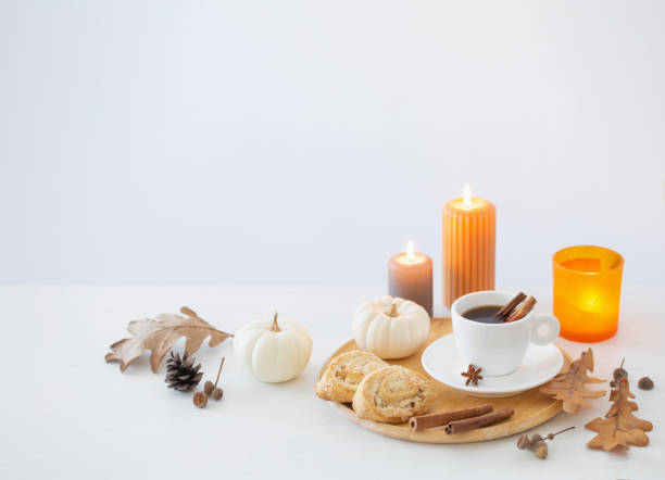 istock white cup of coffee with cozy decor on white table 1642002371