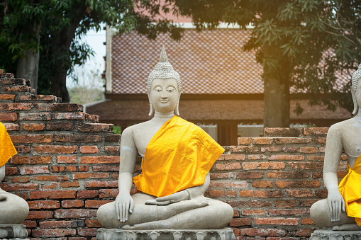 Old Buddha statue made from sand stone at Ayutthaya city, The Old capital city of Thailand and also the world heritage UNESCO, Ayutthaya is the one of famous place to visit in Thailand and Asia.