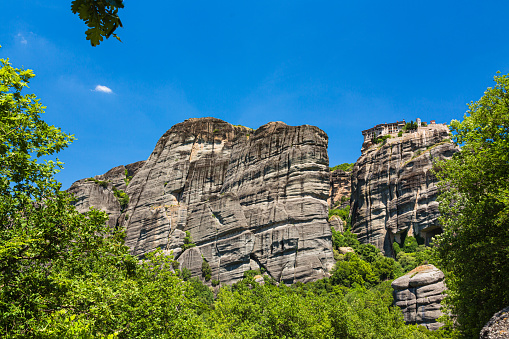 Meteora is a stunning rock formation in Greece with monasteries perched on top. It's famous for its unique landscapes, spiritual significance, and panoramic views. A UNESCO World Heritage Site, Meteora is a blend of natural beauty and cultural history. The Monastery of Varlaam on a rocky mountain on the cliffs of Meteora, Greece