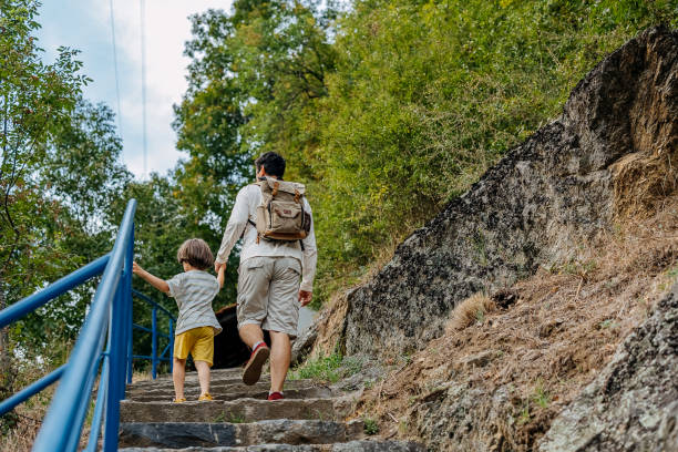 istock Father and son hiking together 1642056507