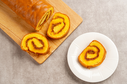 pineapple roll cake (Indonesia bolu gulung nenas) Bolu Gulung is a sponge cake that is baked using a shallow pan, filled with jam or butter cream and then rolled.