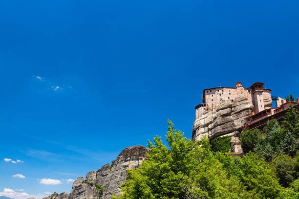 the monastery of rousanou of meteora, greece - greece blue forest national landmark imagens e fotografias de stock