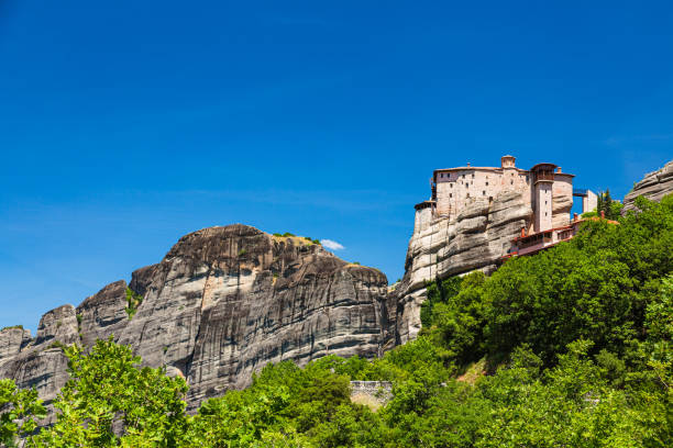the monastery of rousanou of meteora, greece - greece blue forest national landmark imagens e fotografias de stock