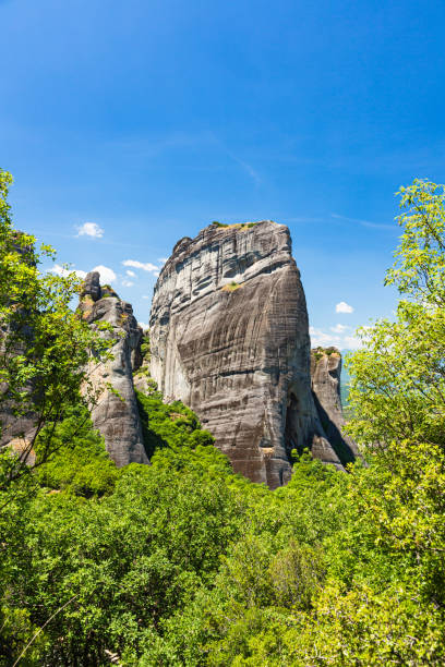 strange rock groups of meteora, greece - greece blue forest national landmark imagens e fotografias de stock