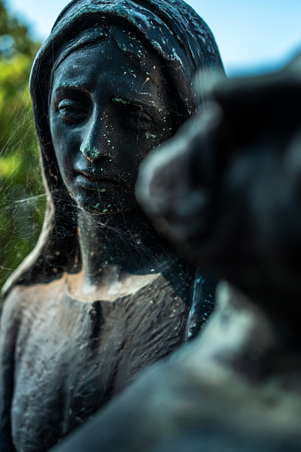 Statue of Virgin Mary in cemetery