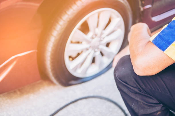 istock Technician is repairing car flat tire 1642085350