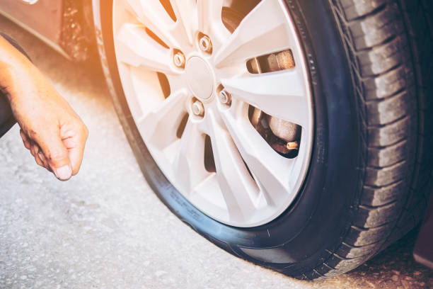istock Technician is repairing car flat tire 1642085368