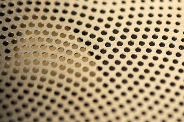 istock Metallic background macro photo grid or column pores. 1642112617