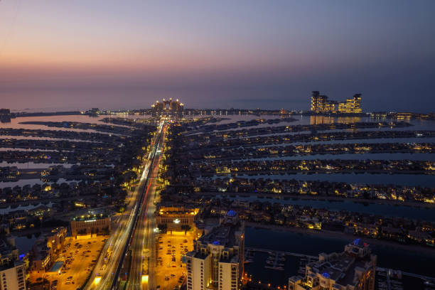 UAE Dubai Palm Jumeirah island cityscape skyline city aerial view blue hour stock photo