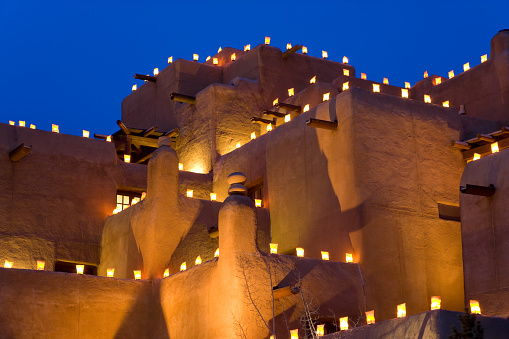 Lanterns lighting traditional adobe building, Santa Fe, New Mexico, USA