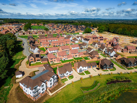 Aerial view, taken by drone, depicting new houses under construction in a suburb in the southeast of England.