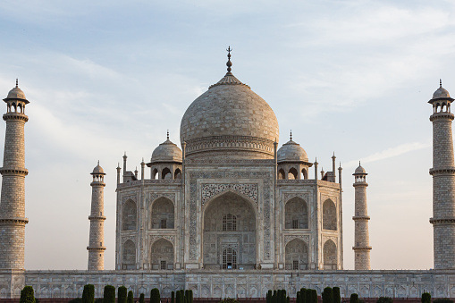 The Taj Mahal is a beautiful white marble building in Agra, India. It was built by a king for his wife and is famous for its intricate design and love story. Many people visit to see its stunning architecture and learn about its history.