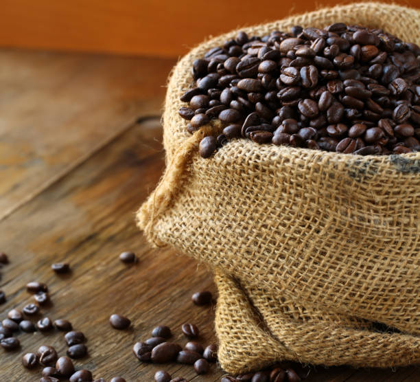 istock coffee beans in a canvas bag on a wooden background 1642360919