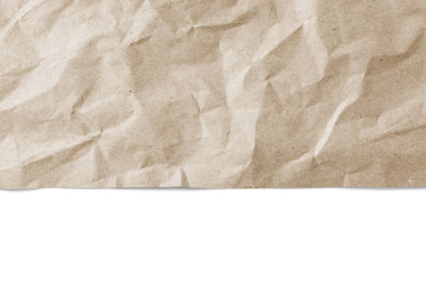istock Recycled crumpled brown paper texture with edge, border isolated on white background 1642366650