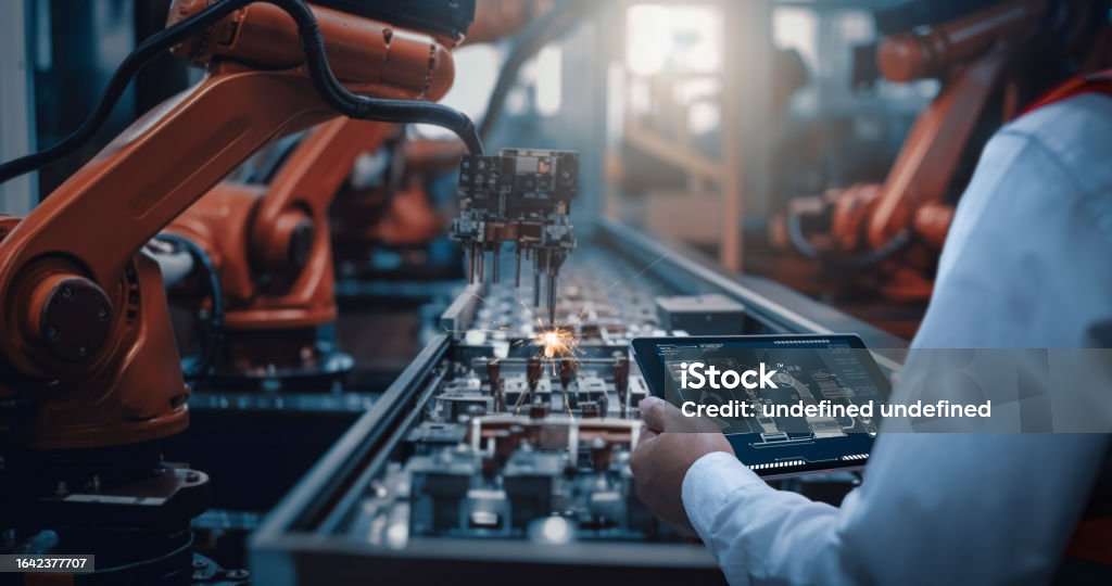 The Rise of Manufacturing Hubs in Southeast Asia engineers test the control of robot arm intelligent machine in factory industrial on real - The Rise of Manufacturing Hubs in Southeast Asia