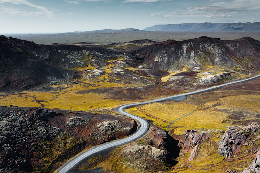 Road through dramatic and colourful volcanic landscape in Iceland (Dyradalur).