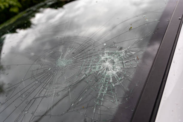 Car windshield damaged by hail stock photo