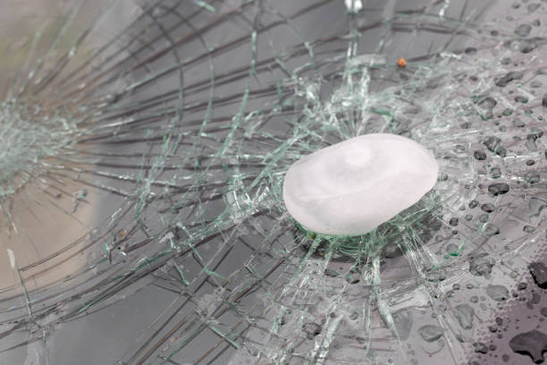 Car windshield damaged by hail stock photo