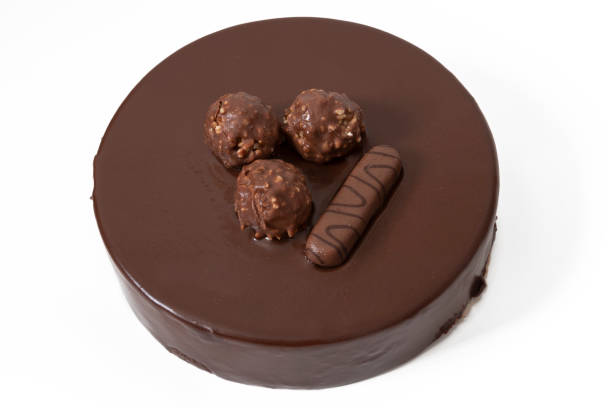 istock A delicious Ferrero Rocher cake, isolated on white background. 1642417564