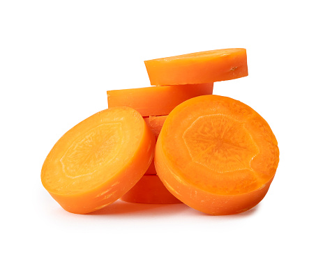 Fresh beautiful carrot slices in stack are isolated on white background witch clipping path. Front view.