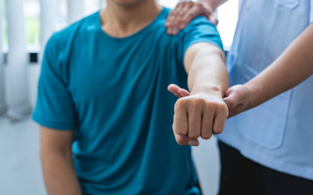 istock Doctor consults patients, shoulder and wrist problems, physical therapy, diagnostic concepts. 1642437996