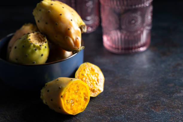 Freshly harvested prickly pears. The prickly pear is the fruit of the nopales cactus, the fruit has a delicious juice and lots of vitamins and minerals. fico d'india stock pictures, royalty-free photos & images