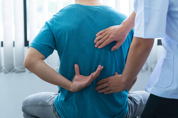 istock Physician consulting patients about back pain problems ,office syndrome problems, physiotherapy diagnosis concept 1642449673
