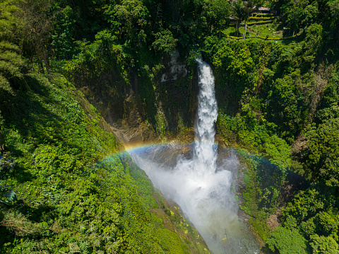 Aerial view of waterfalls wih rainbow. Beautiful splashing of of water from falls. Dongon Seven Falls in Lake Sebu. Mindanao, Philippines.