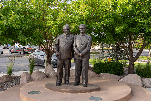 A statue of Colonel Harland Sanders (L) and Pete Harman stands outside the World's First KFC restaurant on 3890 S State St in Salt Lake City, Utah, USA. June 24, 2023.