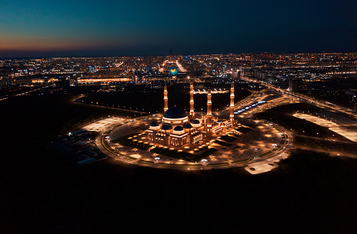 Aerial view of The Grand Mosque of Astana in Kazakhstan at night. It is the largest mosque in Central Asia and one of the largest in the world.