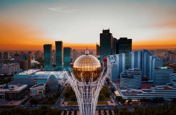 Astana, Kazakhstan - December 12, 2022: Aerial view of Baiterek monument - symbol of Kazakh people freedom duruing beautiful sunset