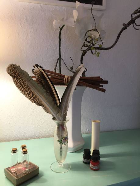 istock Peacock writing feather on a dresser 1642479966