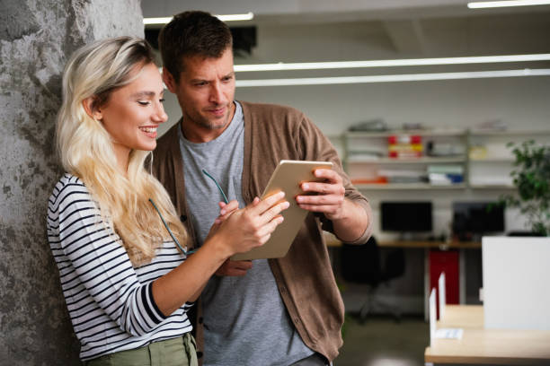 istock Business people having fun, teamwork and chatting at workplace office together. 1642480508