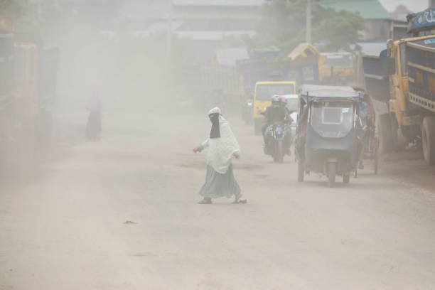 Severe dust pollution adds to commuters' woes on the road at Shayempur, in Dhaka, Bangladesh, August 26, 2023. Dust pollution reaches an alarming stage in Dhaka and many deaths as well as several million cases of illness occur every year due to the poor air quality. Dhaka has long been grappling with air pollution issues. Its air quality usually turns unhealthy during winter and improves during monsoon. With the advent of winter, the city's air quality starts deteriorating sharply due to the massive discharge of pollutant particles from construction works, rundown roads, brick kilns and other sources.