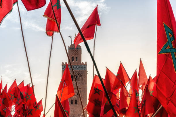 istock Moroccan flags and landmark minaret tower 1642484893