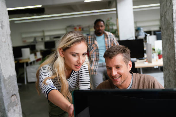 istock Business solutions, technology and strategy concept. Colleagues working and brainstorming in office 1642488114