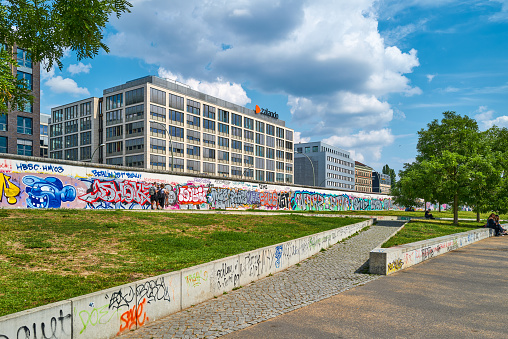 Brussels, Belgium – December 02, 2022: Colorful impression on an empty skateboard park with dense grafitti against an urban background