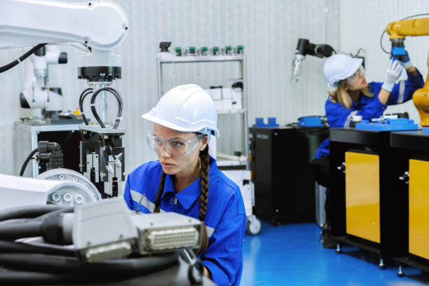 istock female automation machine engineer student study and inspection control robot arm machine in university or factory workshop. ai robot technology new innovation trend of manufacturing in industry 5.0 1642502148
