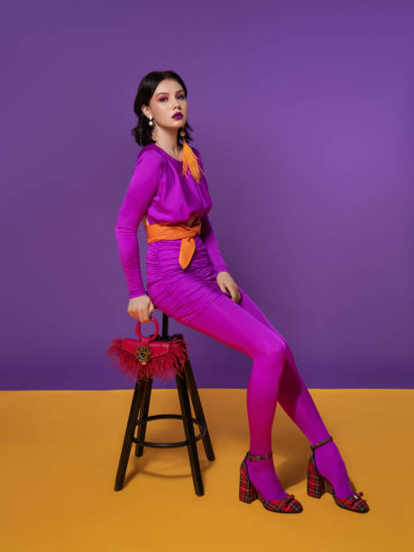istock Fashion model sitting on a chair 1642513497