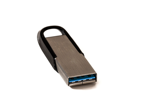 A pen drive isolated on a white background. An elegant portable storage solution: the pen drive, which packs digital potential into a compact design.