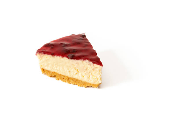 A cheesecake with a layer of raspberry jam isolated on a white background.