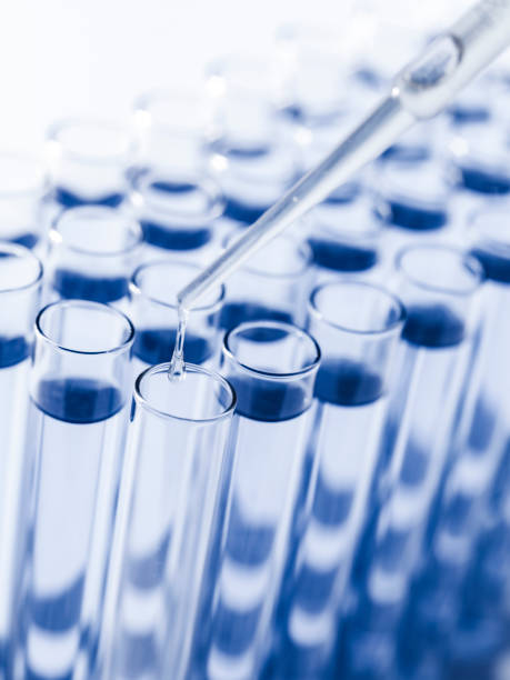 istock Droplet Falling from Pipette into Test Tube. 1642532860