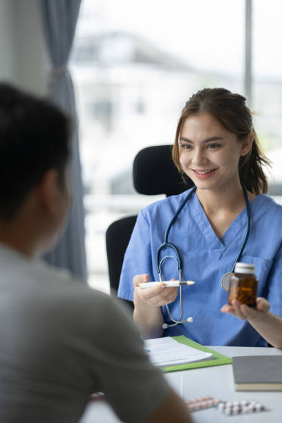 istock Confident female doctor with medical stethoscope introducing and explaining treatment guidelines, medication, care, therapy to patients. concept of treatment, service, consultation, health insurance 1642533447