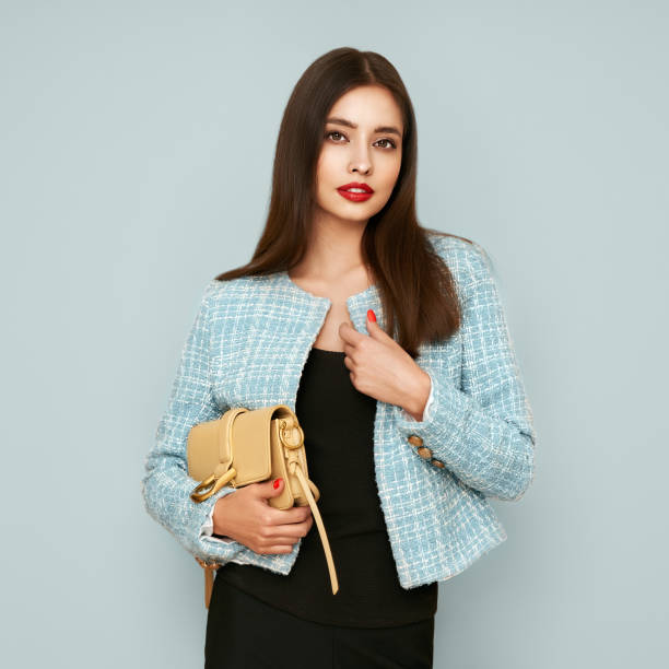 istock Young brunette woman in blue jacket 1642533458