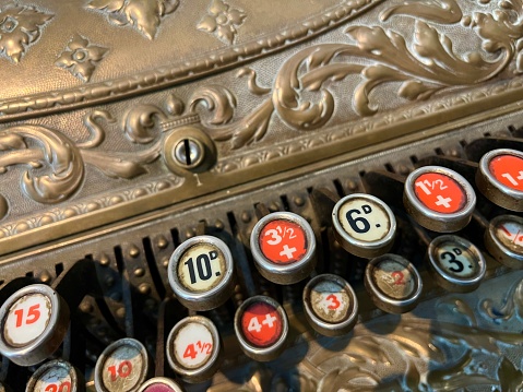 Vintage computing machine close-up image with typ buttons. Used in the pre Computer Era.