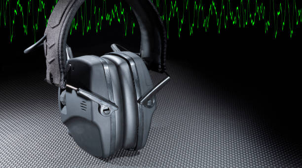 istock Copy space next to green sine wave and protective headphones 1642563191